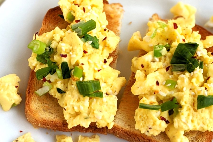 no salt scrambled eggs recipe low sodium eggs recipes healthy scrambled eggs with water sesame oil green onion chili flakes and scallions to top.