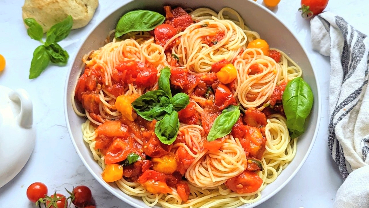 low sodium tomato sauce recipe with basil fresh tomatoes canned tomatoes in a bowl with a napkin